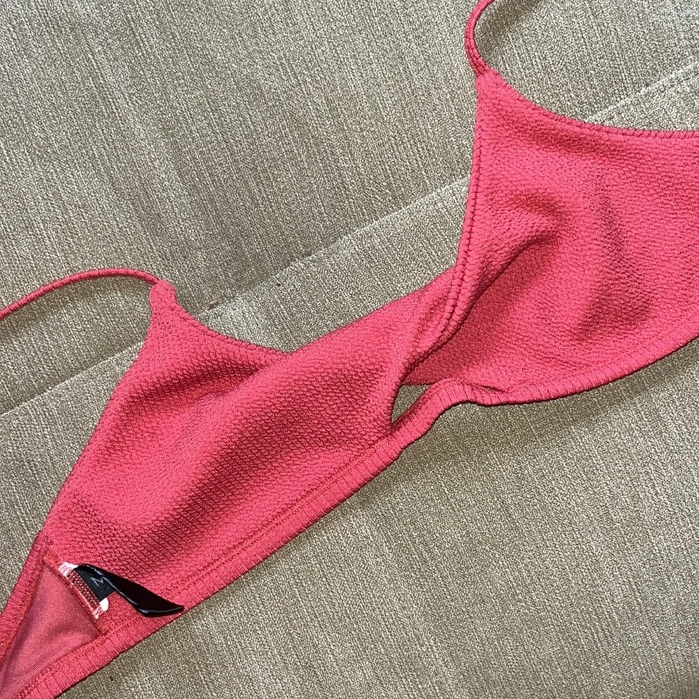 MINKPINK Kaya Twist Front Bikini Top in color Berry Textured Size Medium